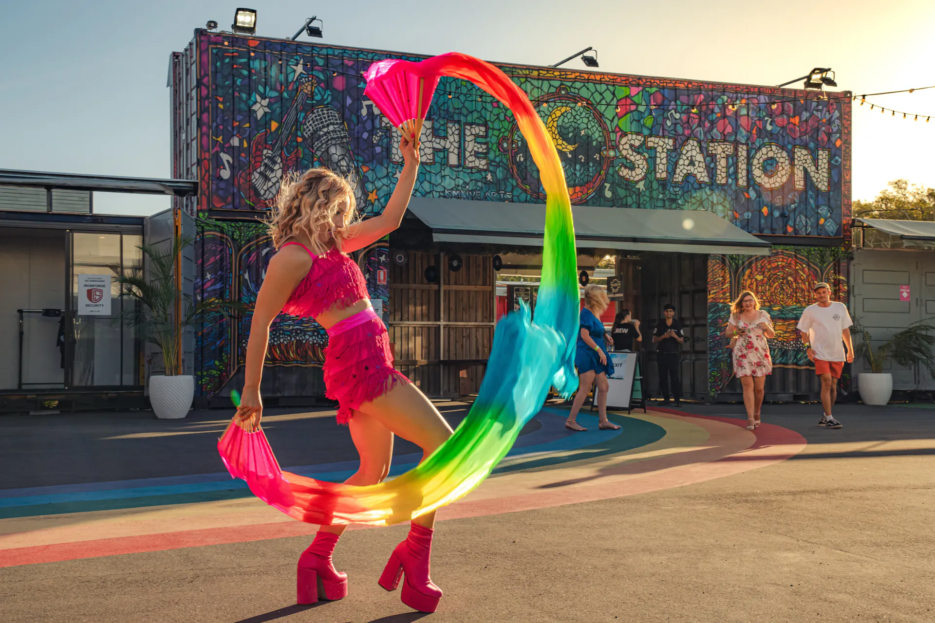 Entry to The Station showing dancer with colourful fan silks