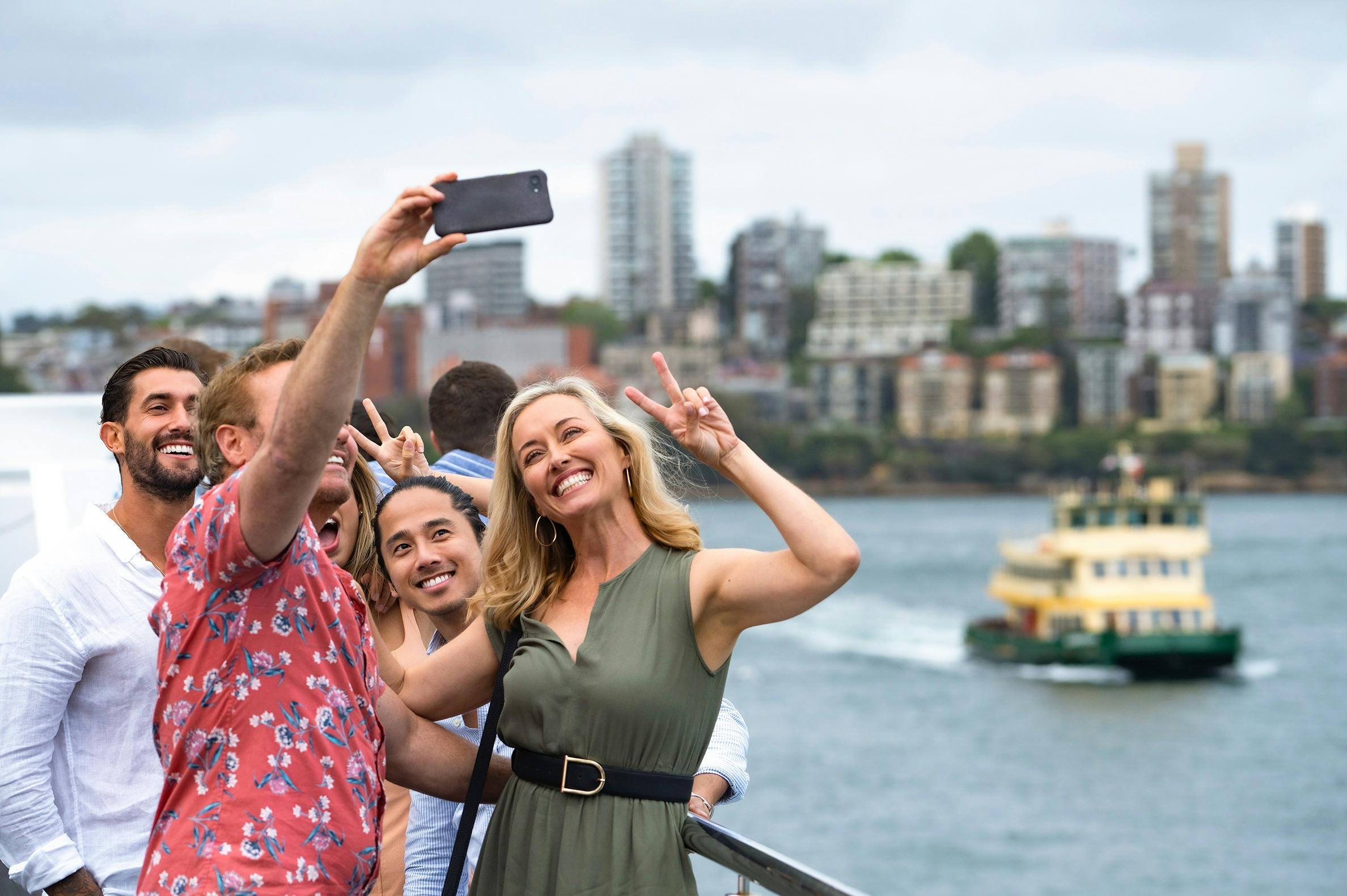 Group of friends taking selfie onboard Sydney 2000