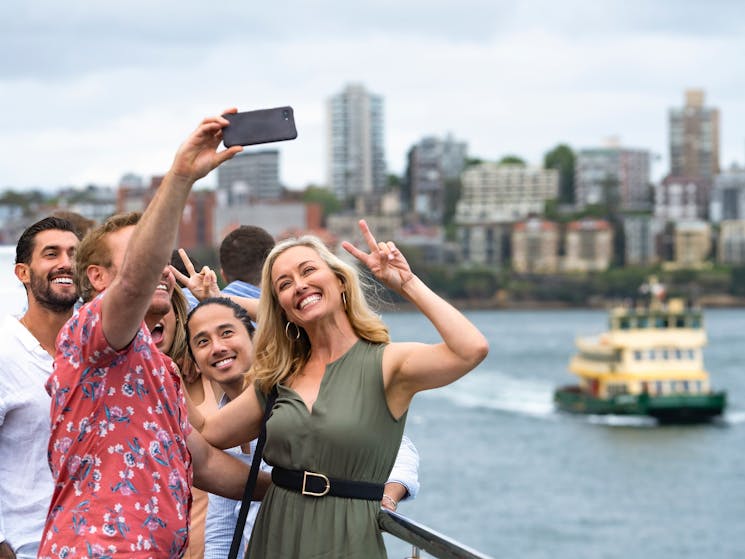 Group of friends taking selfie onboard Sydney 2000
