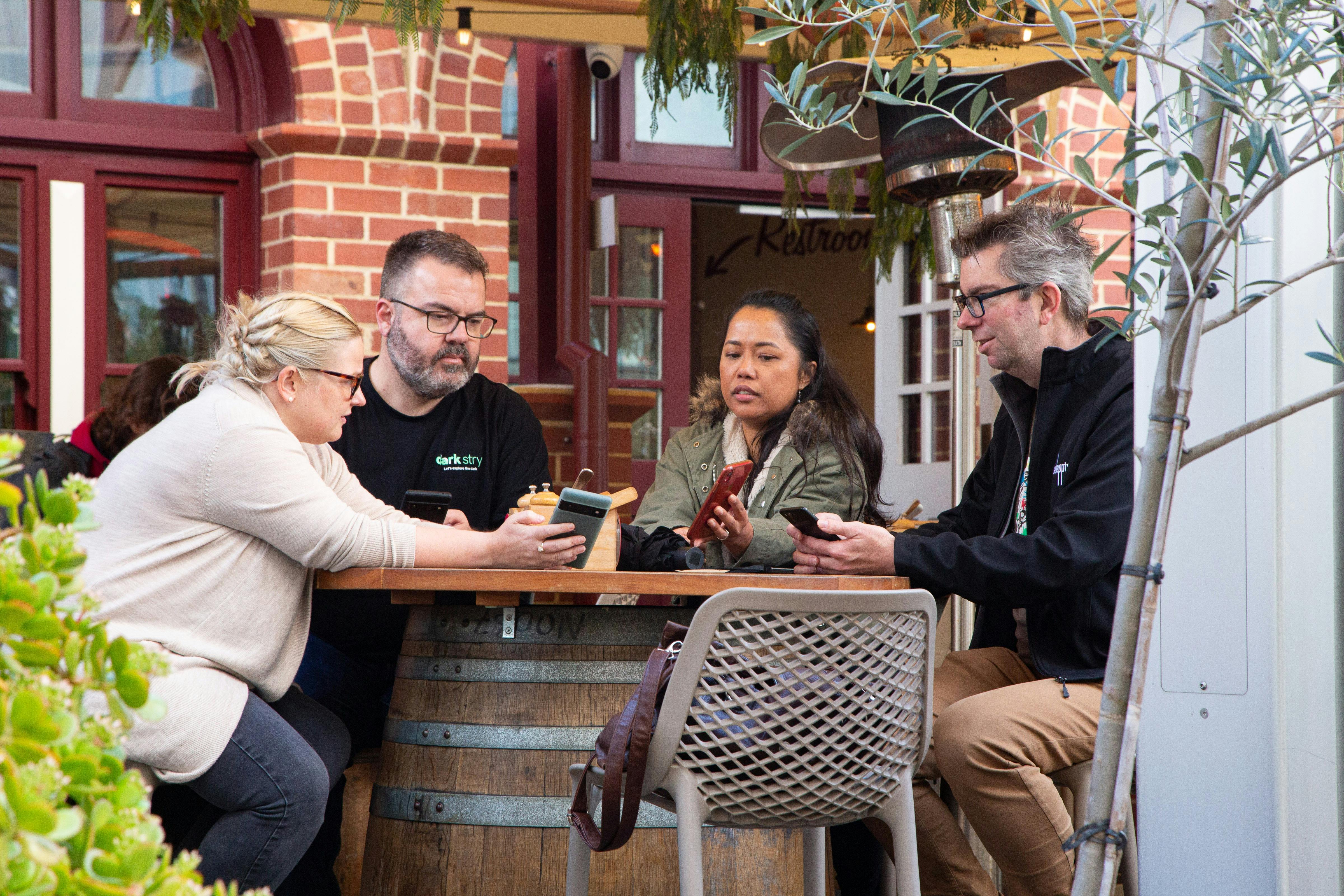 Group of people comparing their phones