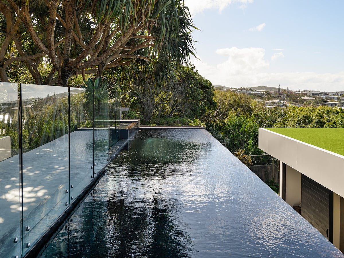 Indulge in the 14 metre lap pool featuring a captivating wet edge & Sun beds.