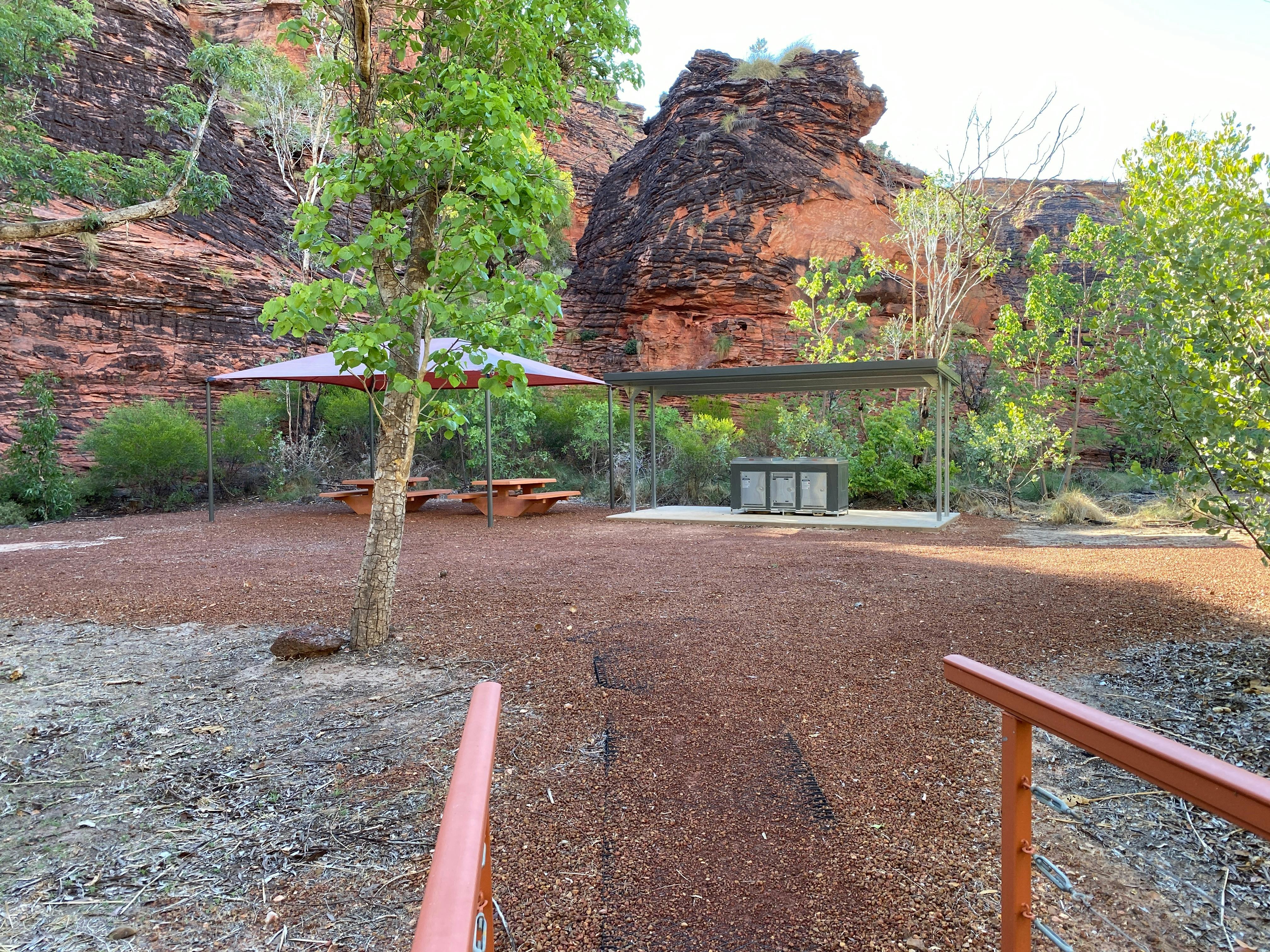 Shade shelter and barbeque.