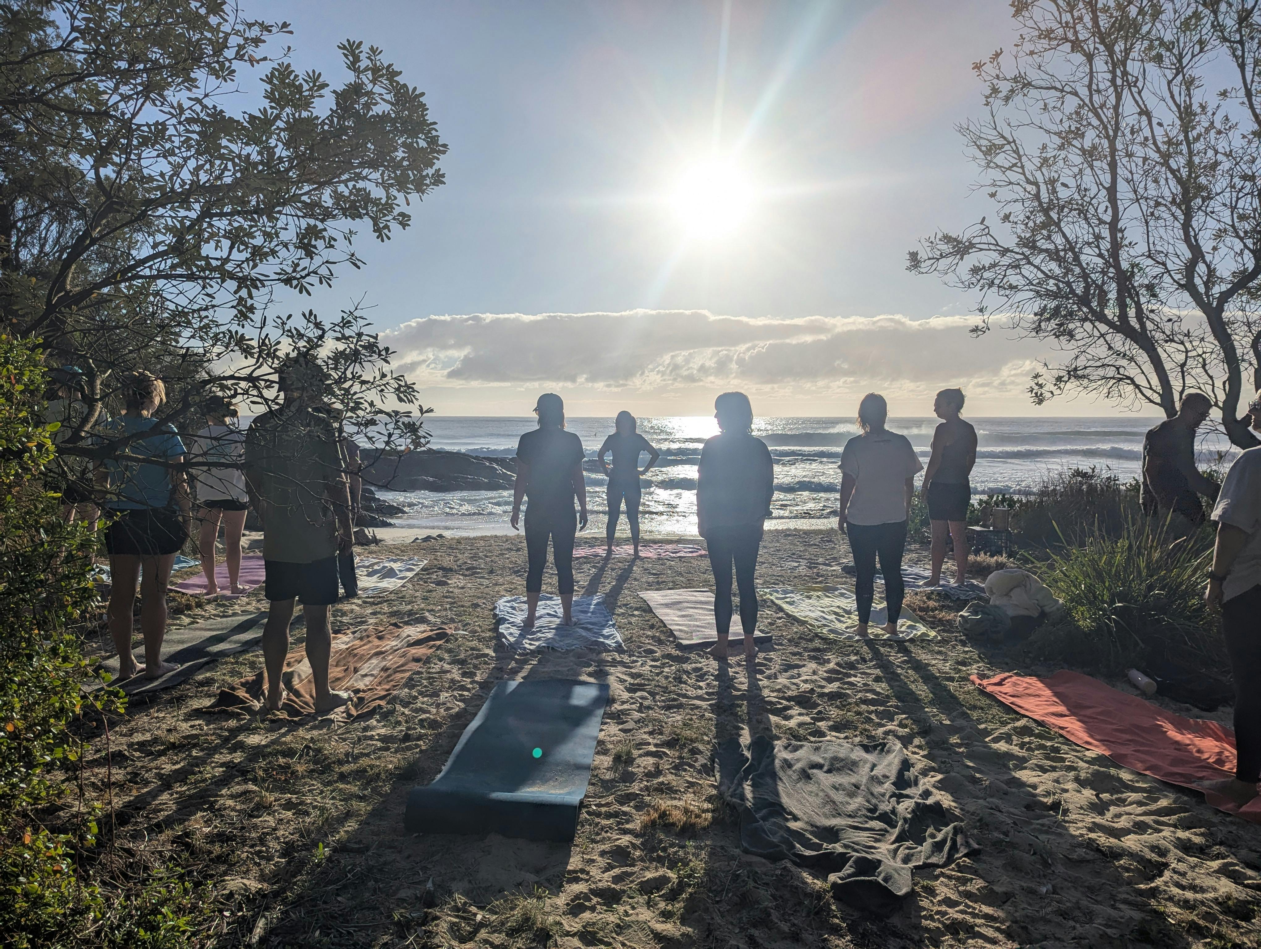 Pure yoga life—Sankalpa intention setting during barefoot beach yoga at Potato Point NSW.