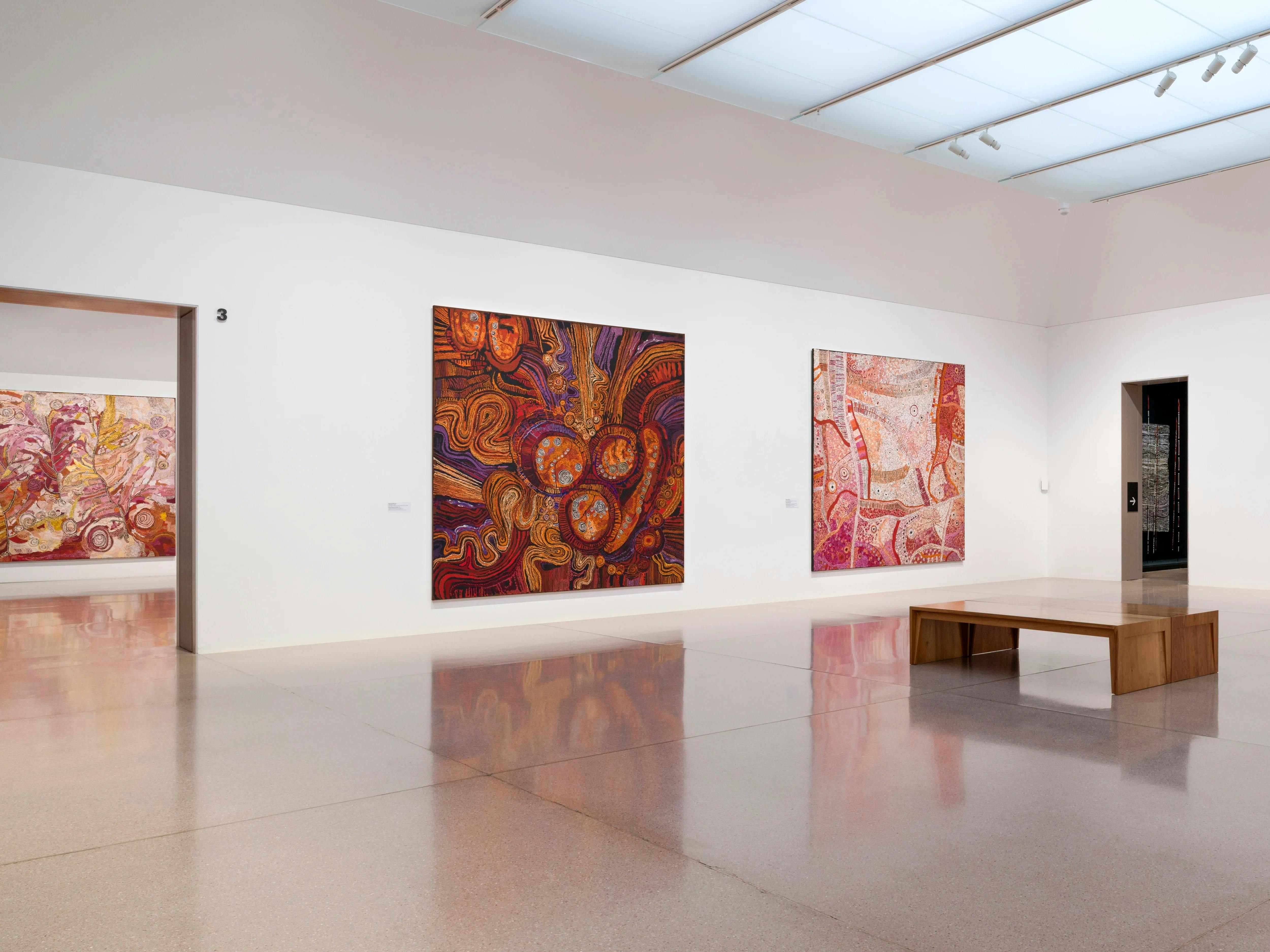 Installation view of large and colourful first nation's works