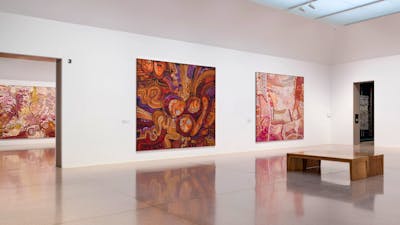 Installation view of large and colourful first nation's works