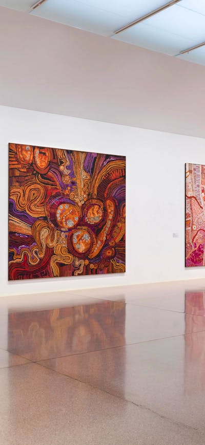 Installation view of large and colourful first nation's works