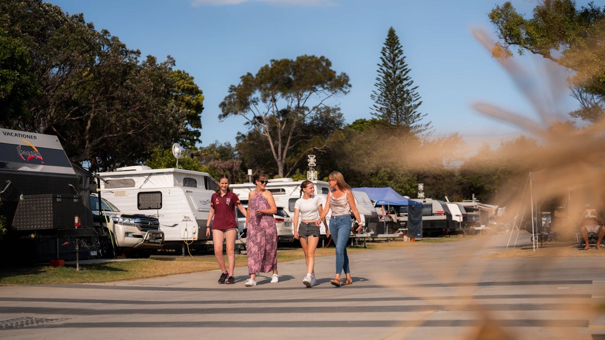 Shot of a family walking through the park