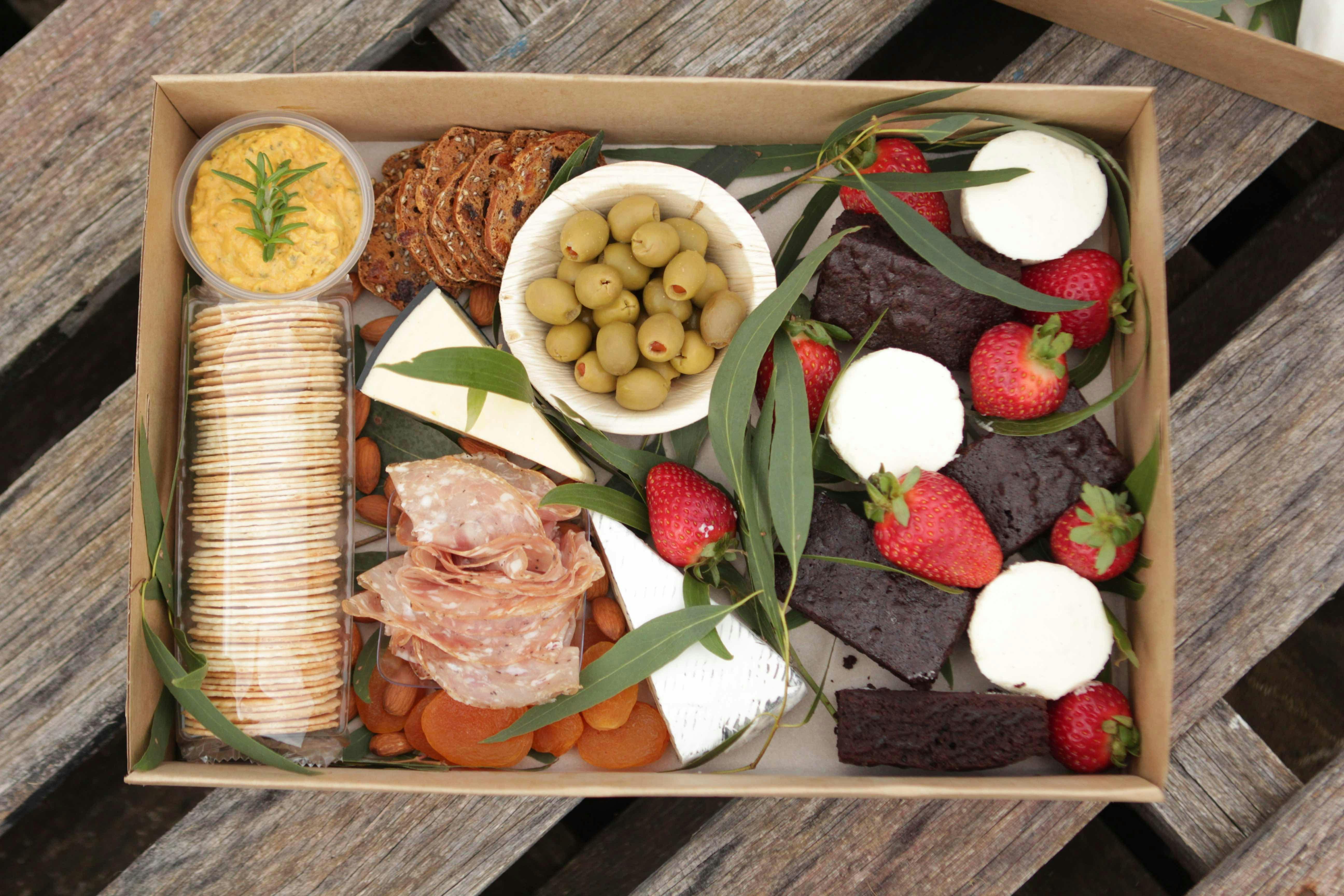 A platter box with sweet and savoury foods