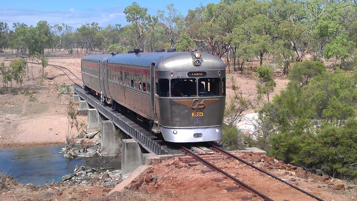 The Savannahlander railmotor units crossing a bridge