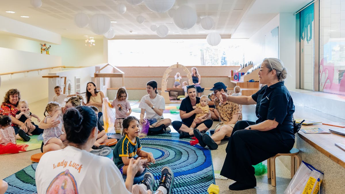 families and children playing in a circle