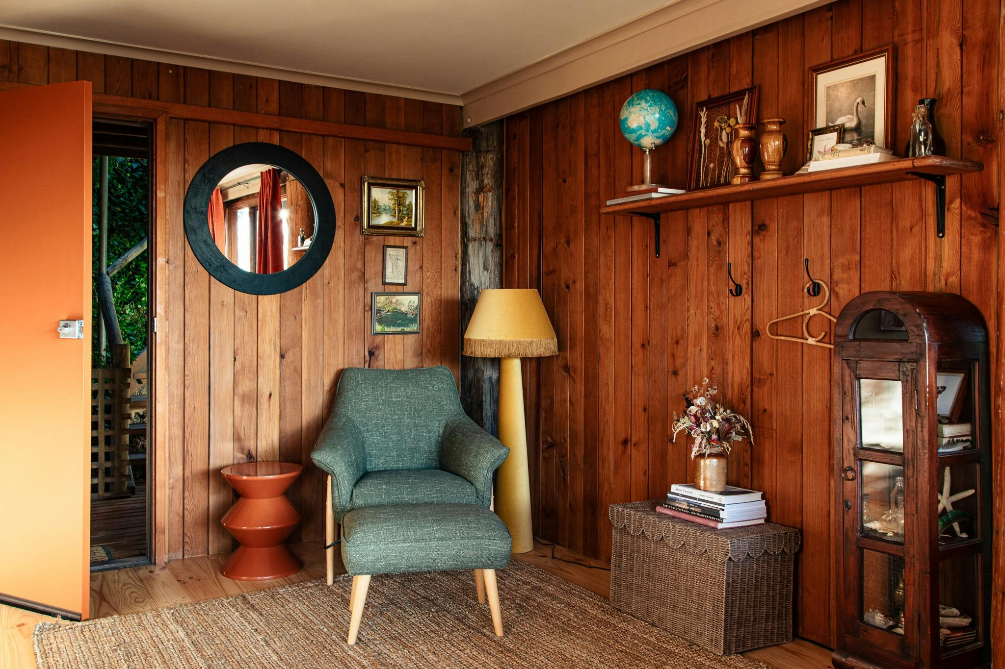 A lounge chair and floor lamp