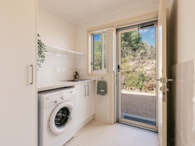 The laundry area can be accessed from outside and so is perfect for cleaning off after a beach day