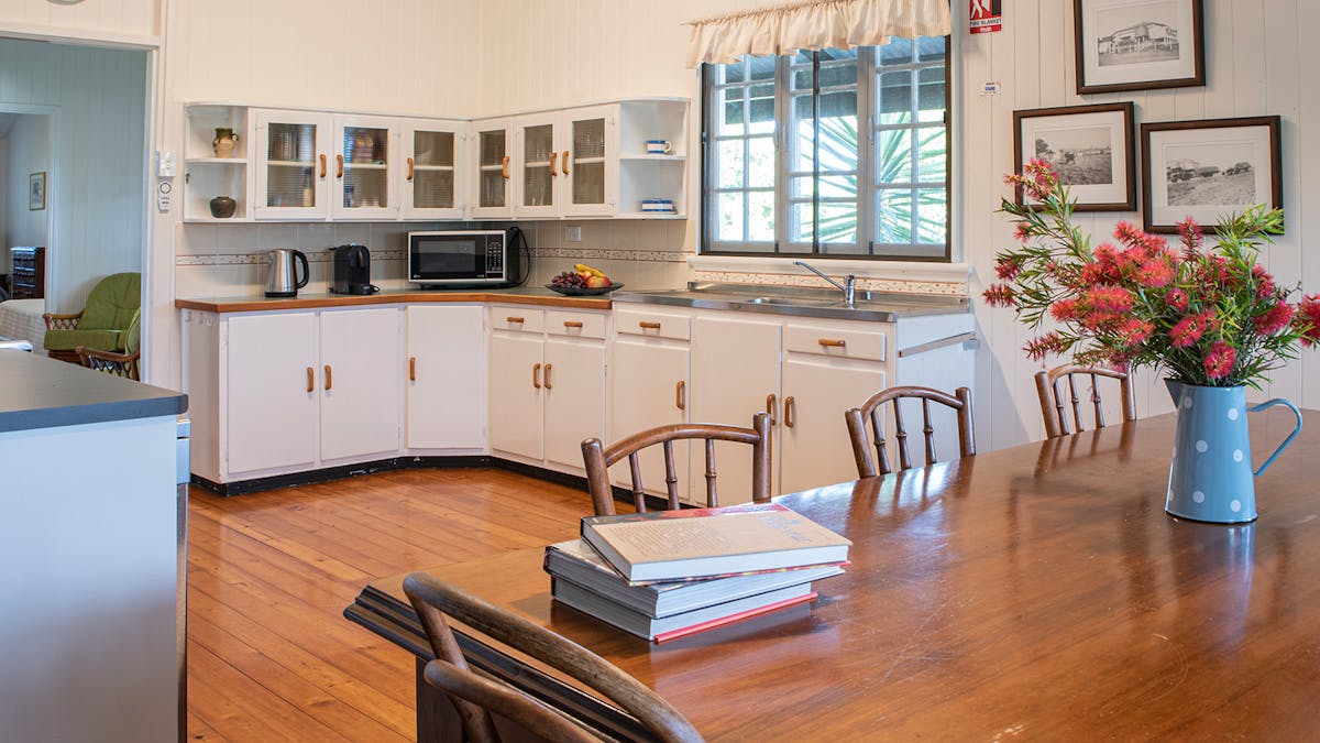 Family dining table in open plan heritage kitchen Family dining table in open plan heritage kitchen