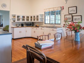 Family dining table in open plan heritage kitchen