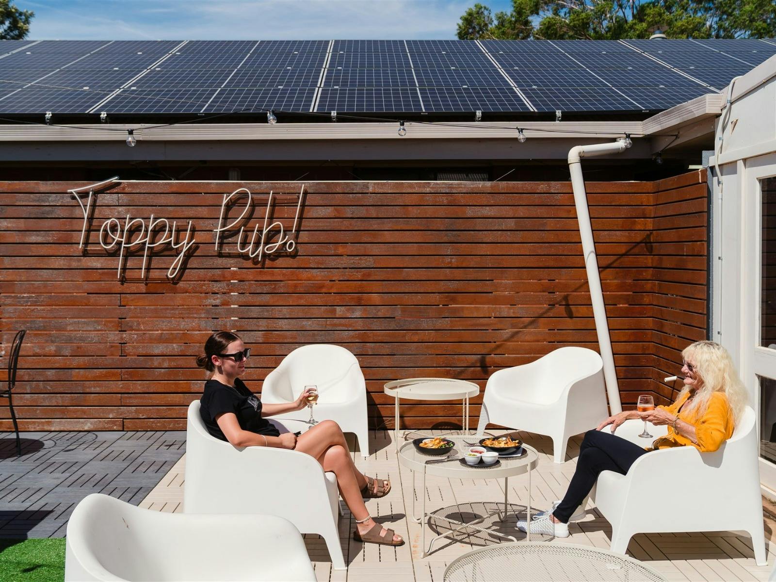 People relaxing in the beer garden of Top Town Tavern