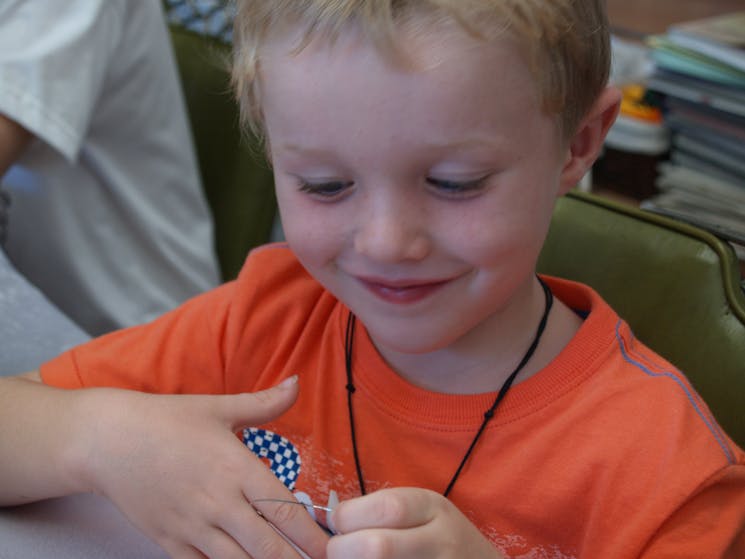 Ages 4+ love the holiday beading activities held at Bead Shack through holiday times