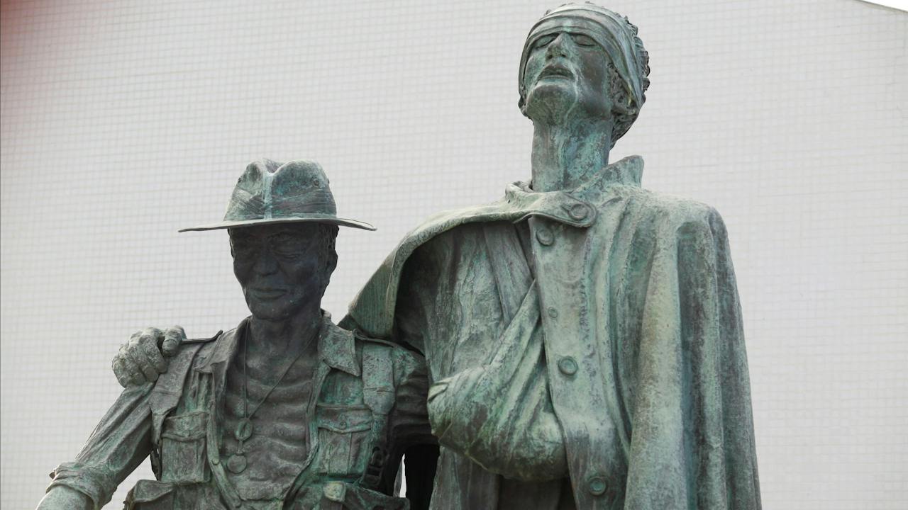 Mateship - Beaten copper by Bela Angyal, inspired by Damian Parer