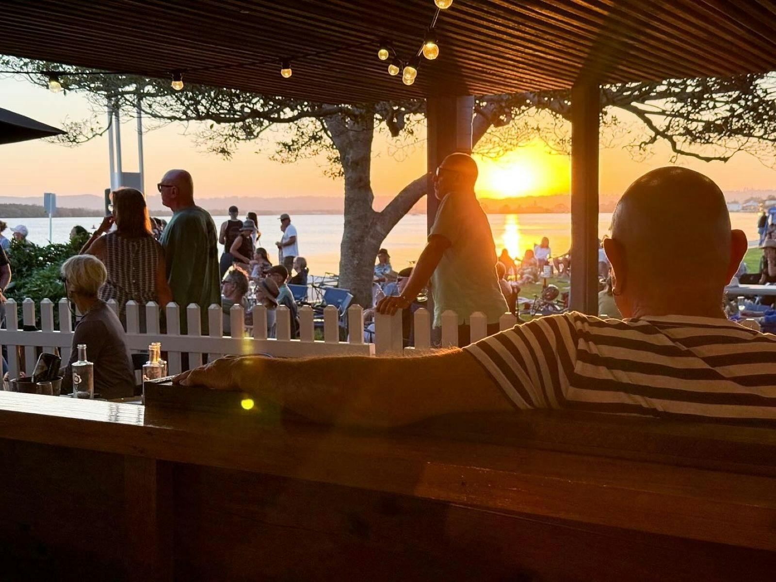 sunset and crowd at wharf river club concert