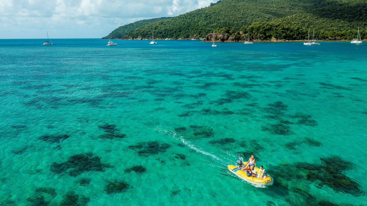 Family riding in tender over Coral Reef, Whitsundays