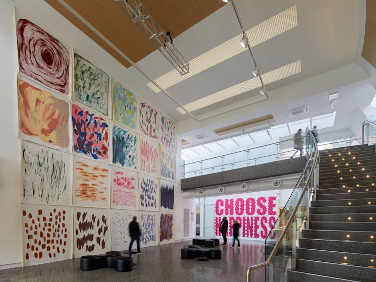 Large scale wall paintings in foyer of art museum