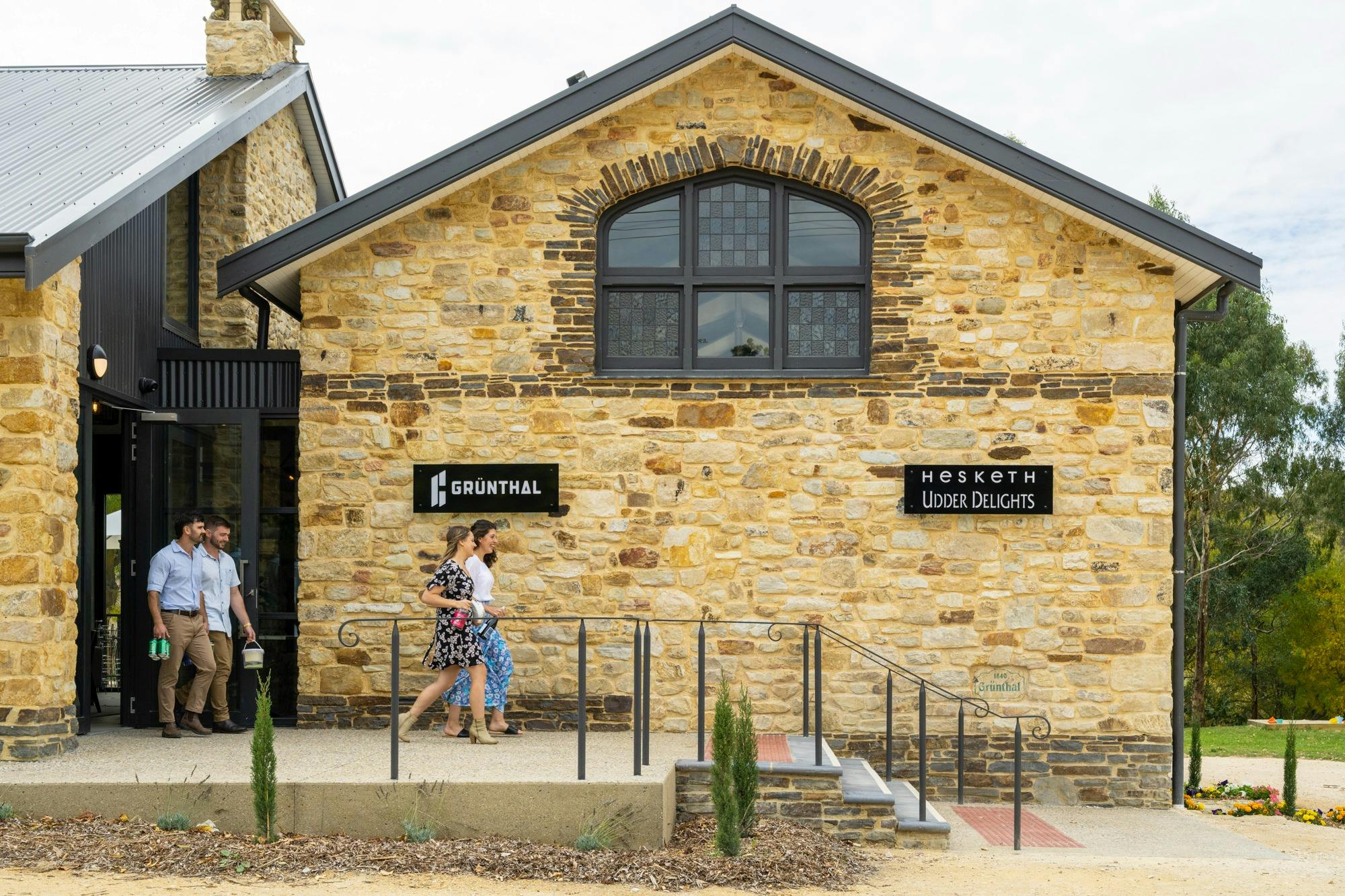 Customers leaving Grunthal Brew stone building