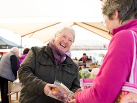 Women laughing at markets