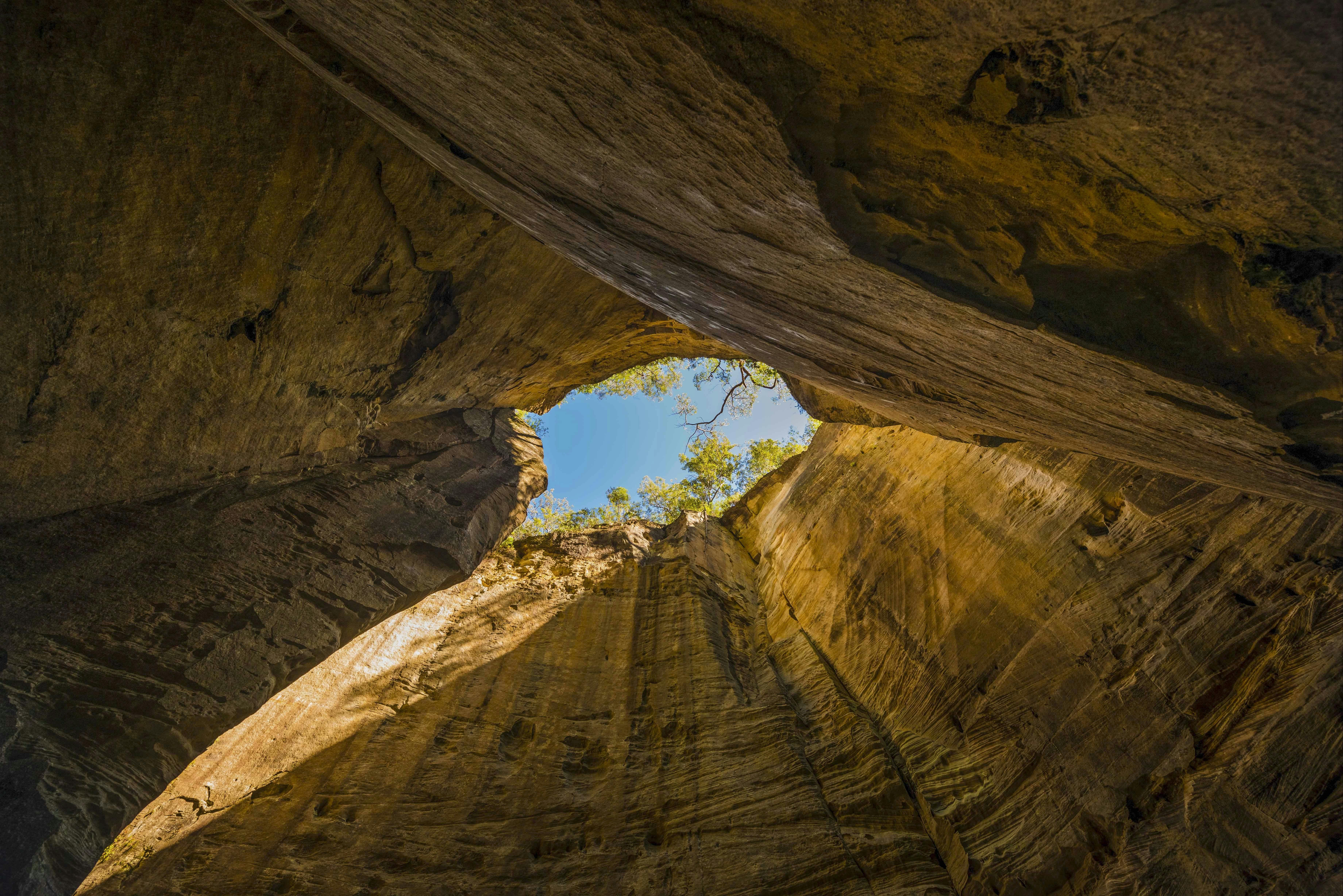 Sunlight filters into the Amphitheatre, lighting up the towering sandstone cliffs.