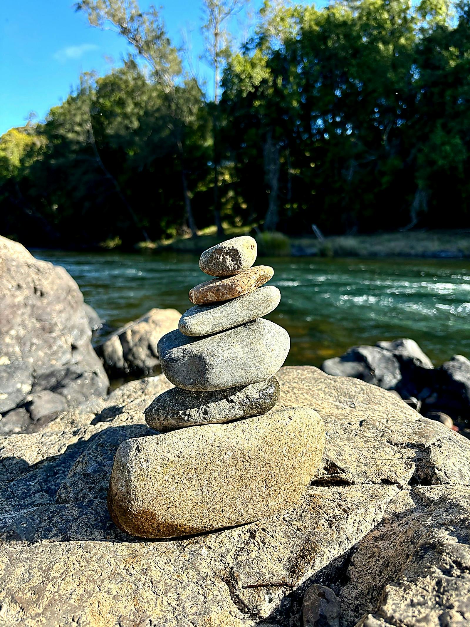 Rocks creating a natural stupa on the river bank