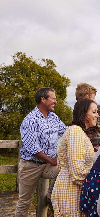 family pointing at wind turbines