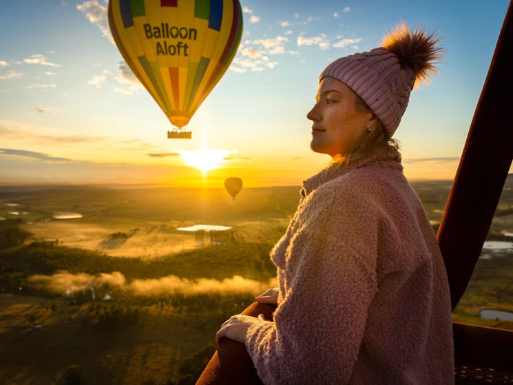 hot air balloon with a person standing in front