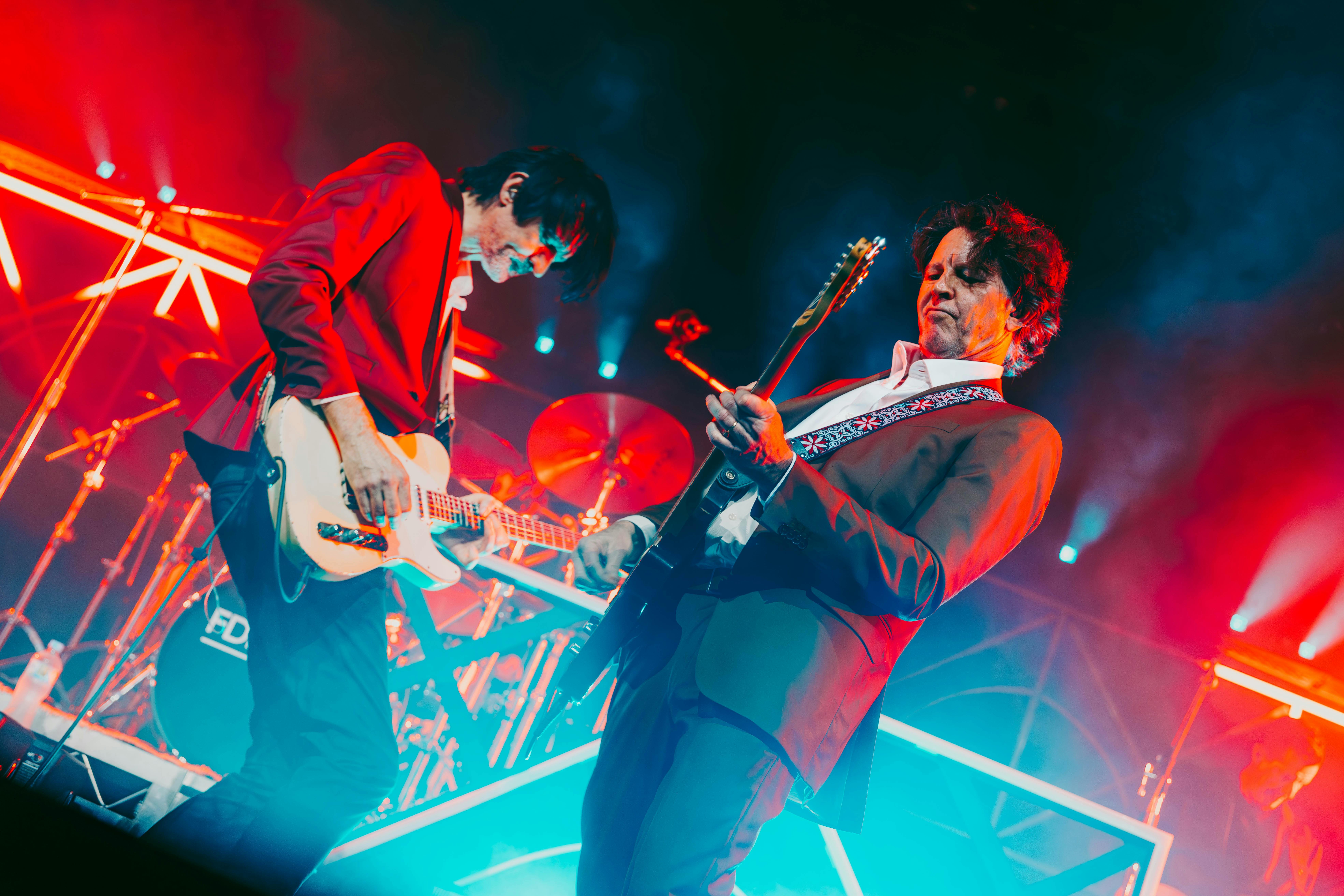 Bernard Fanning and Paul Dempsey performing on stage