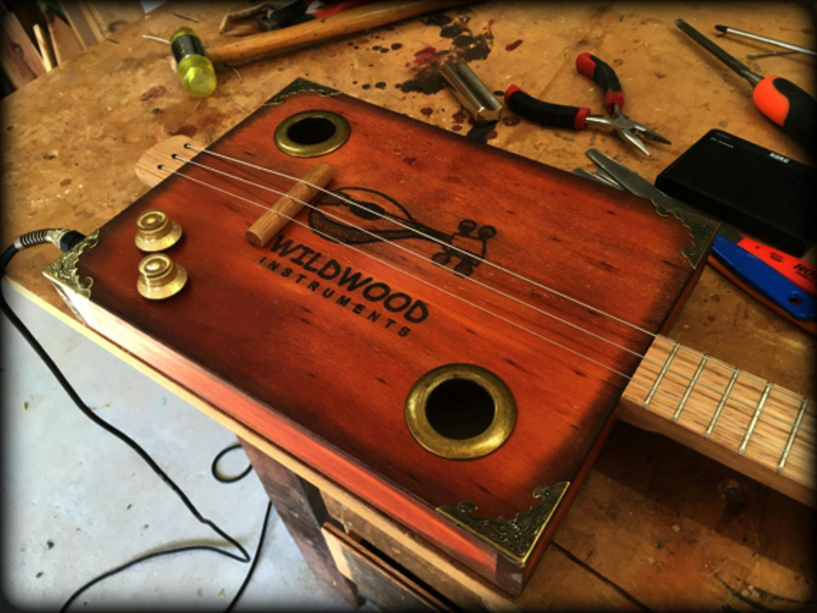 Cigar Box Guitar on Bench