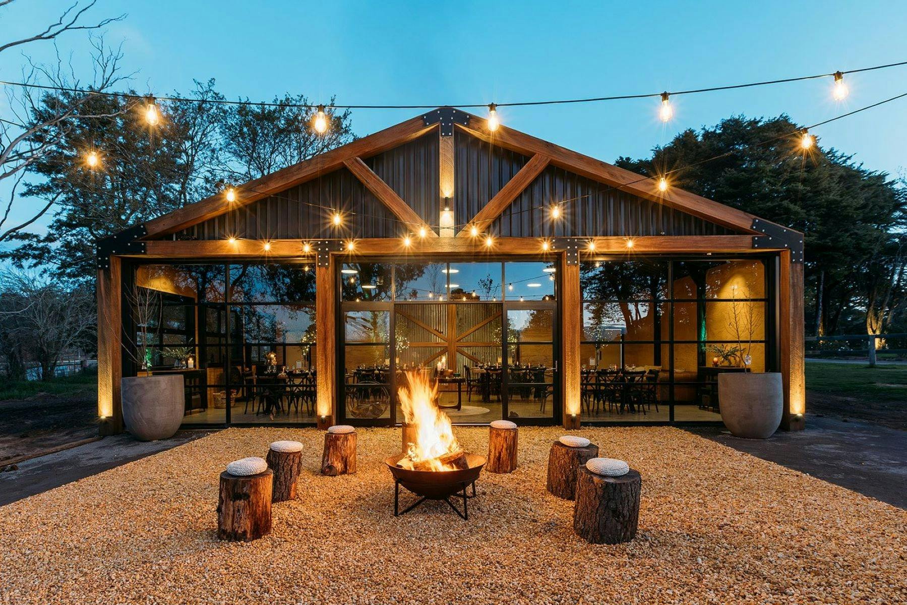 Event building for conference retreats and meetings with a firepit for work events fairy lights