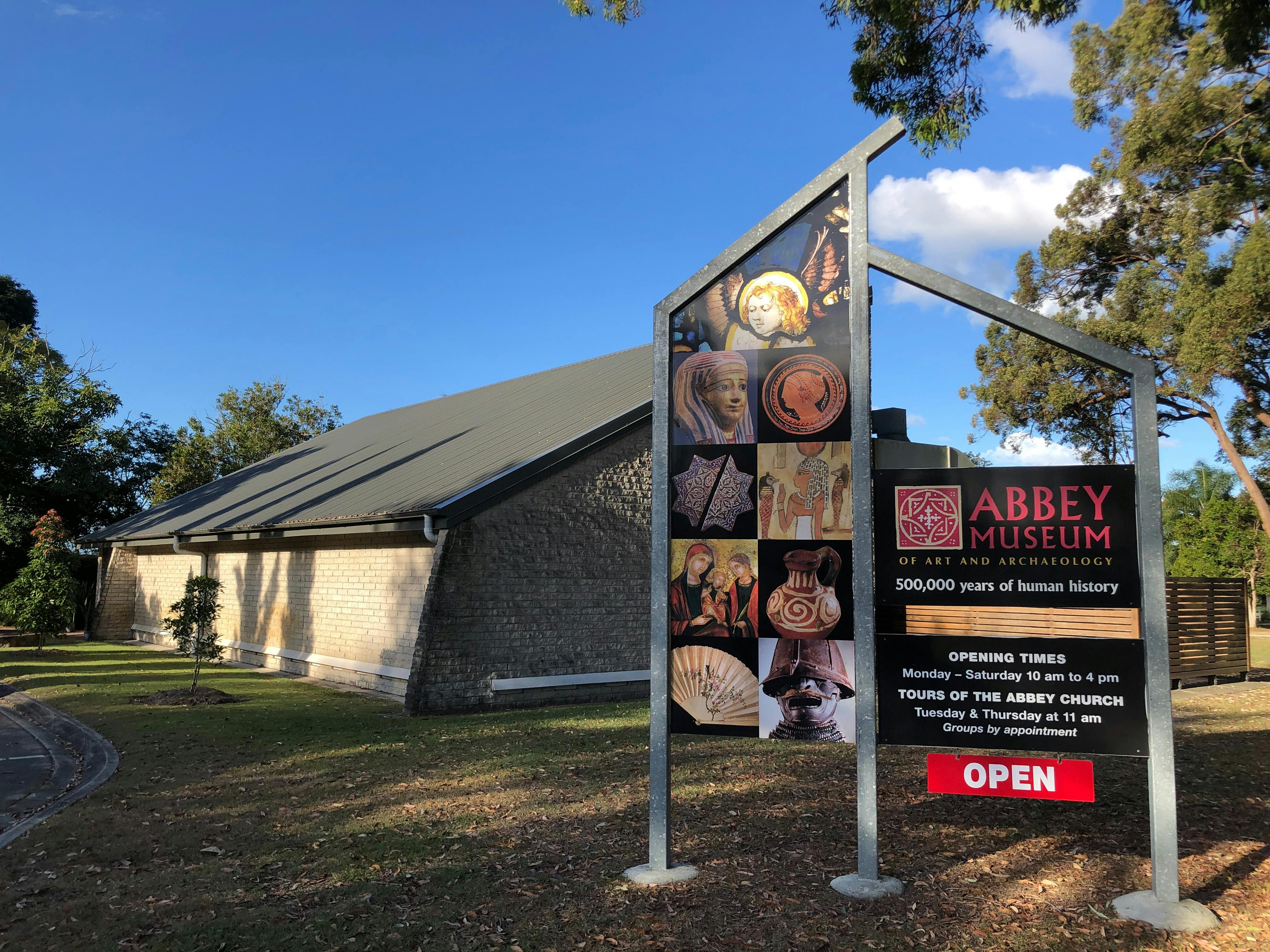 Entry Signage and Building image of the Abbey Museum