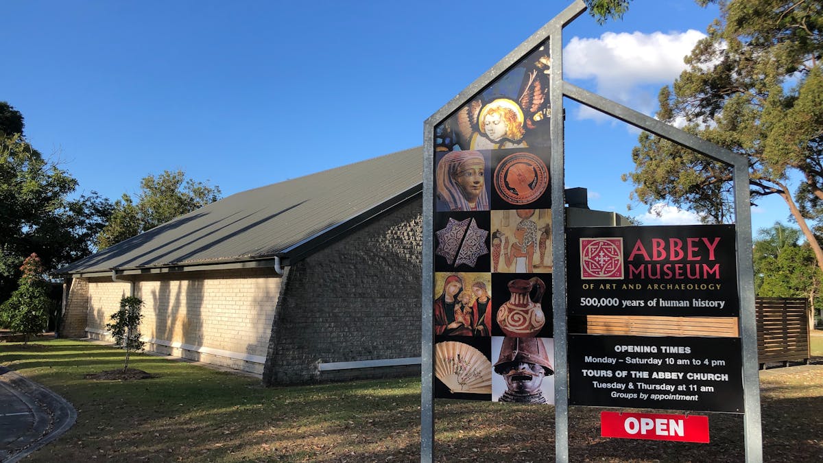 Entry Signage and Building image of the Abbey Museum