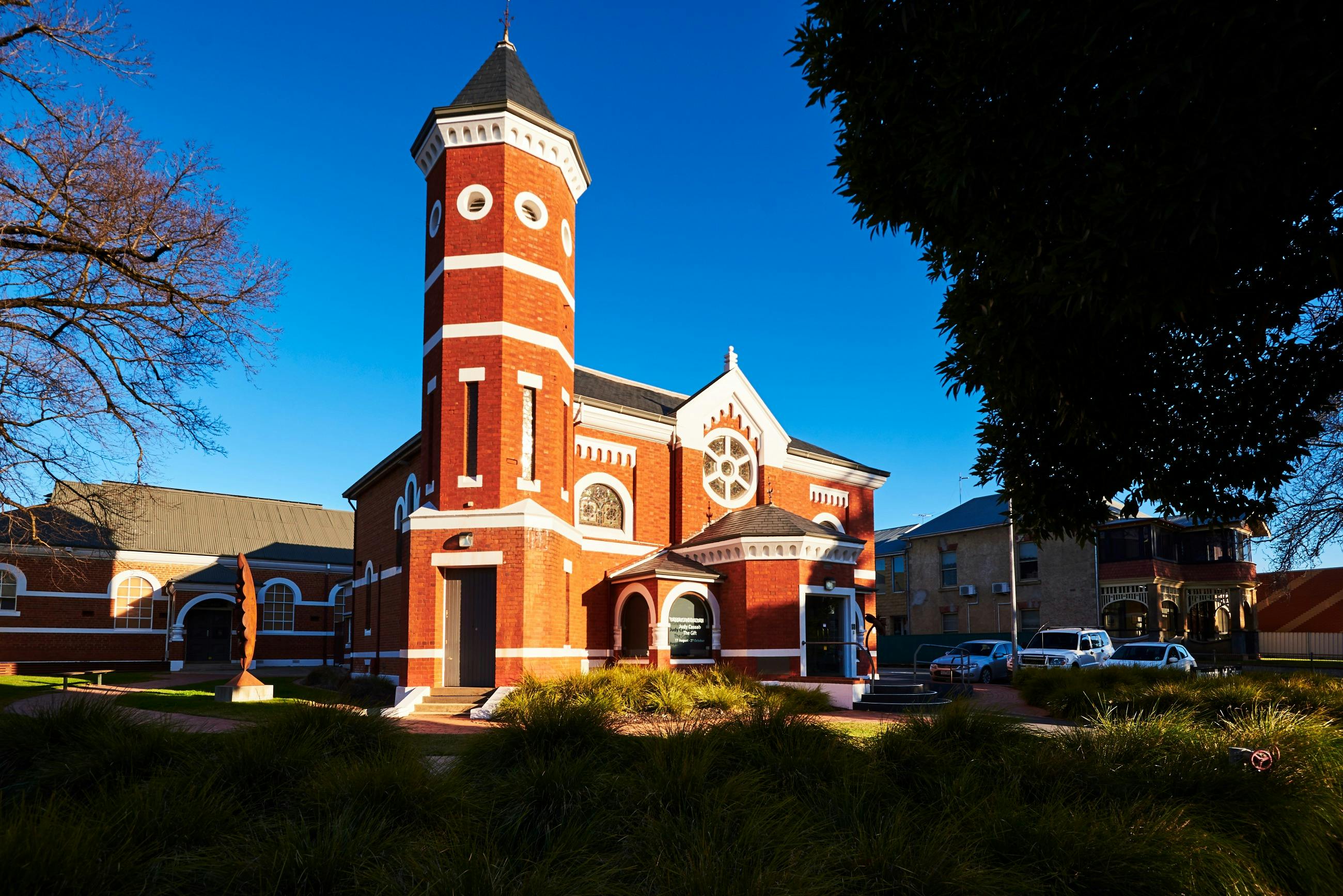 Wangaratta Art Gallery housed within historic church bell tower entrance garden trees