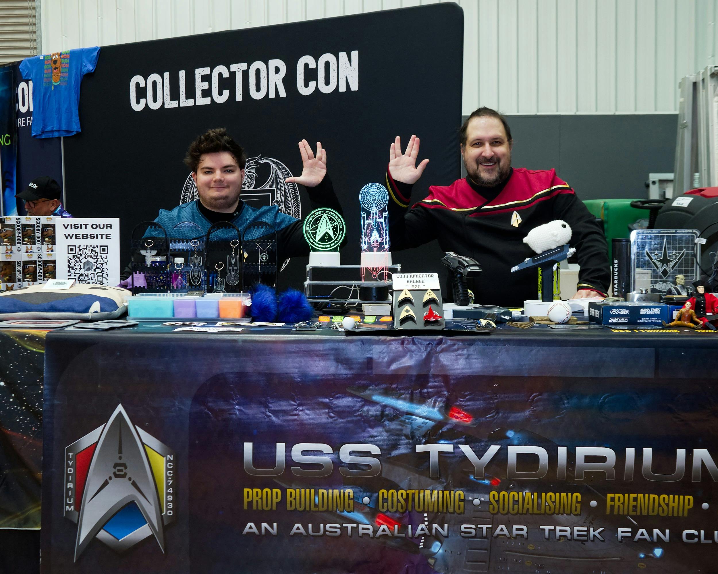 Two Star Trek cosplayers posing behind stall