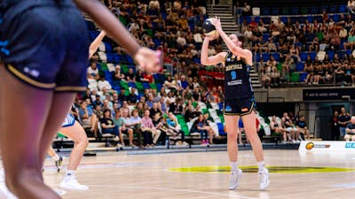 UC Capitals player shooting the basketball while a defender closes in.