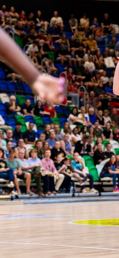 UC Capitals player shooting the basketball while a defender closes in.