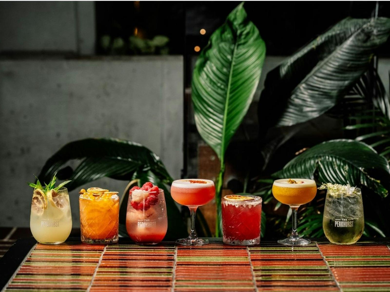 Lineup of colourful cocktails
