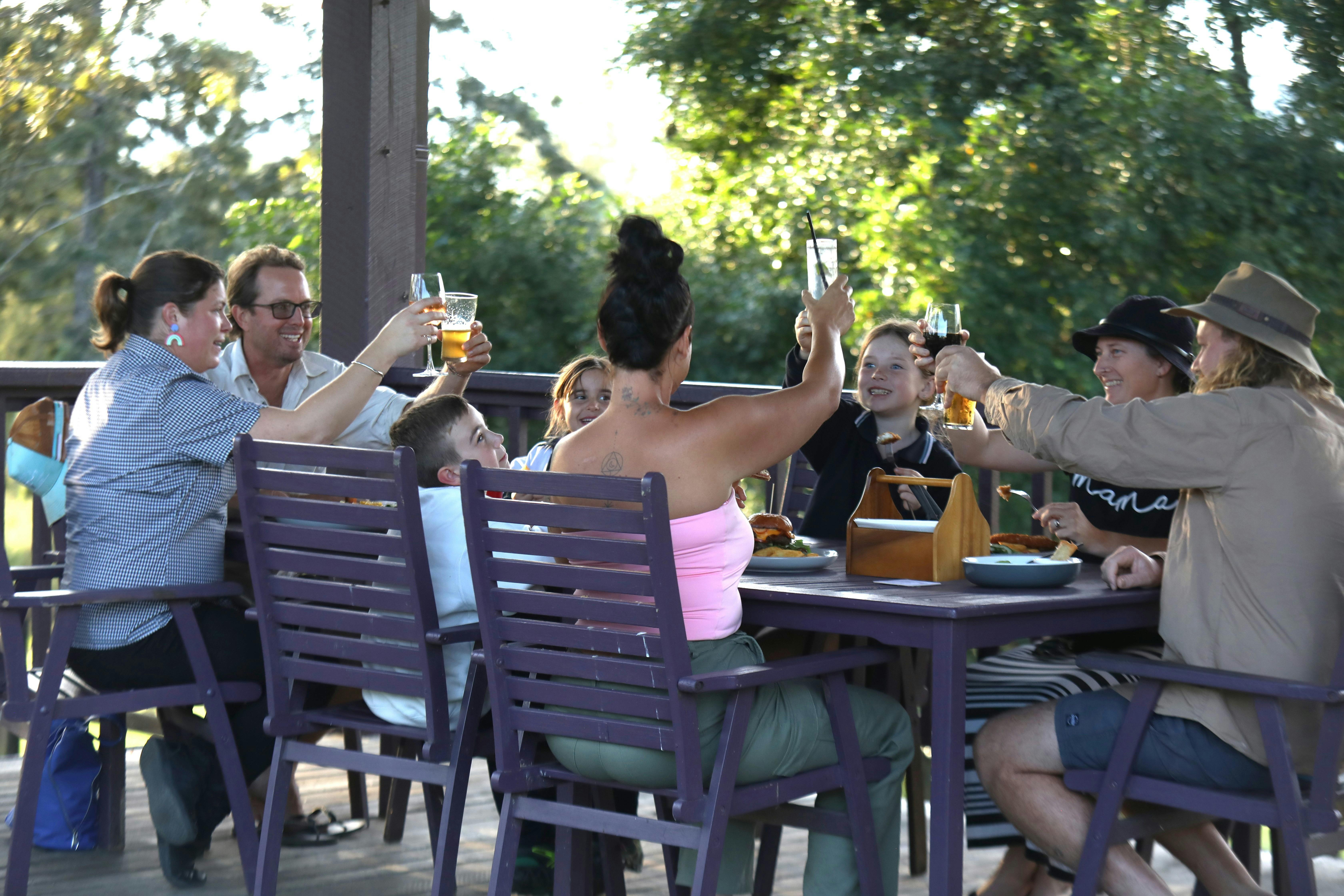 Group of people enjoying a meal at Long Flat Pub