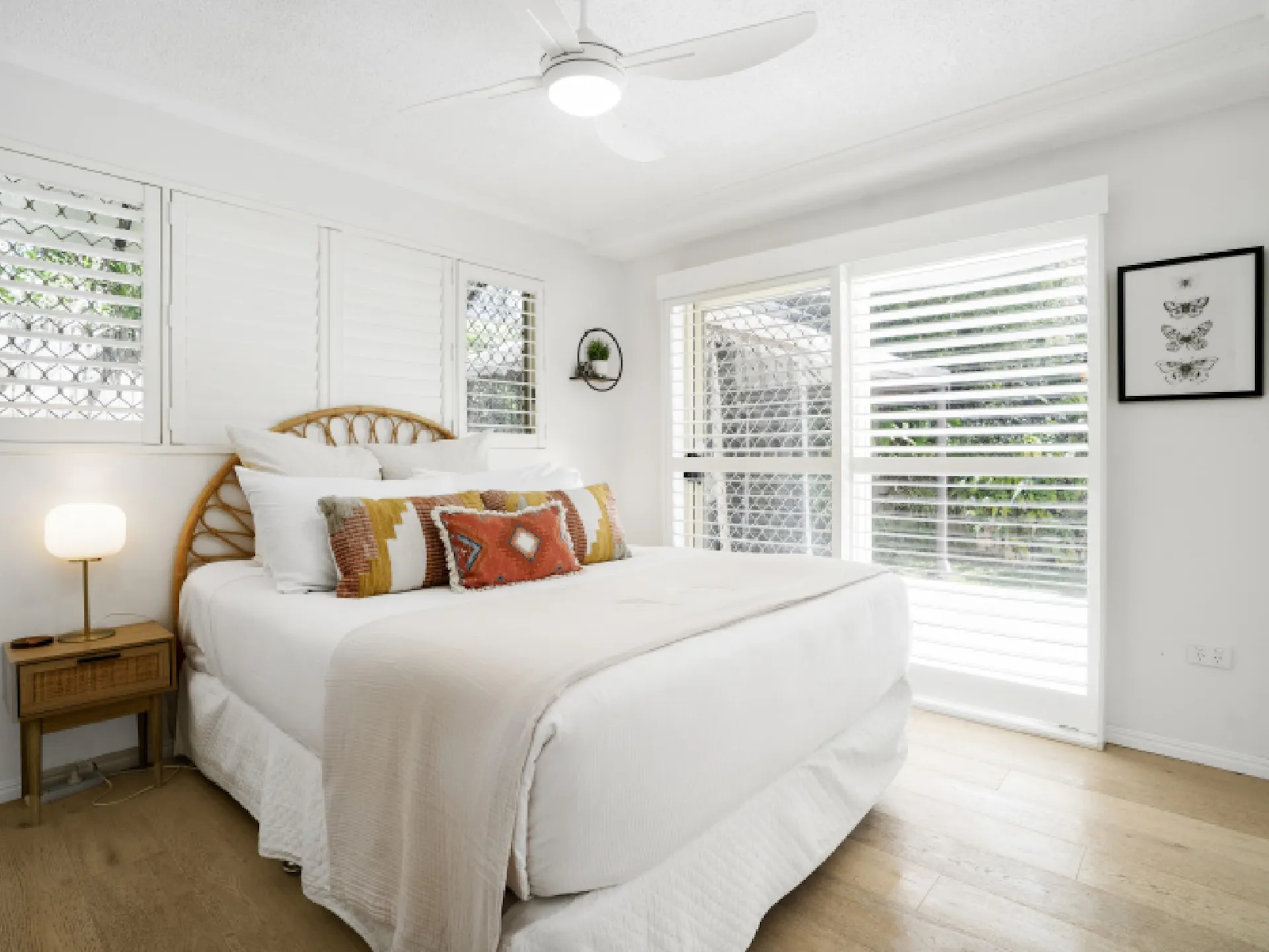 Master bedroom with ensuite bathroom and patio access