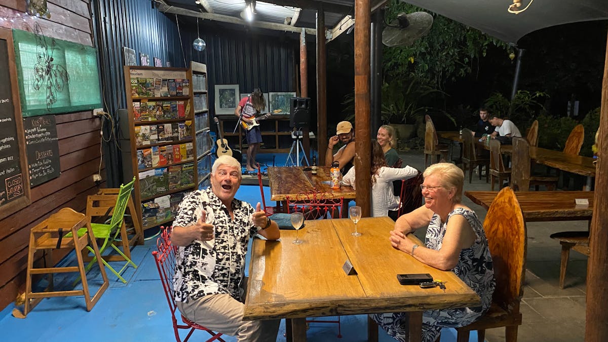 Daintree Siesta Restaurant diners at table and live musician in background