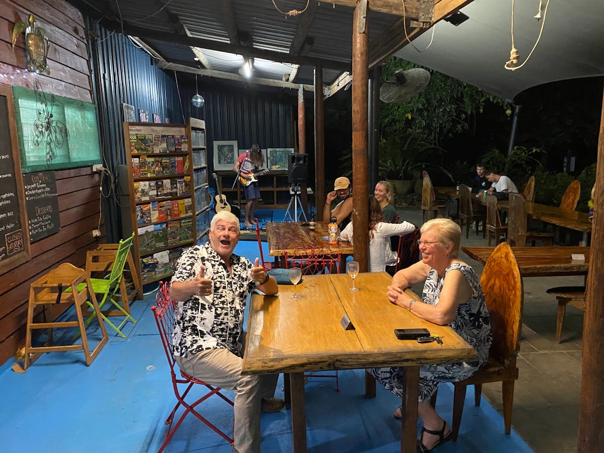 Daintree Siesta Restaurant diners at table and live musician in background