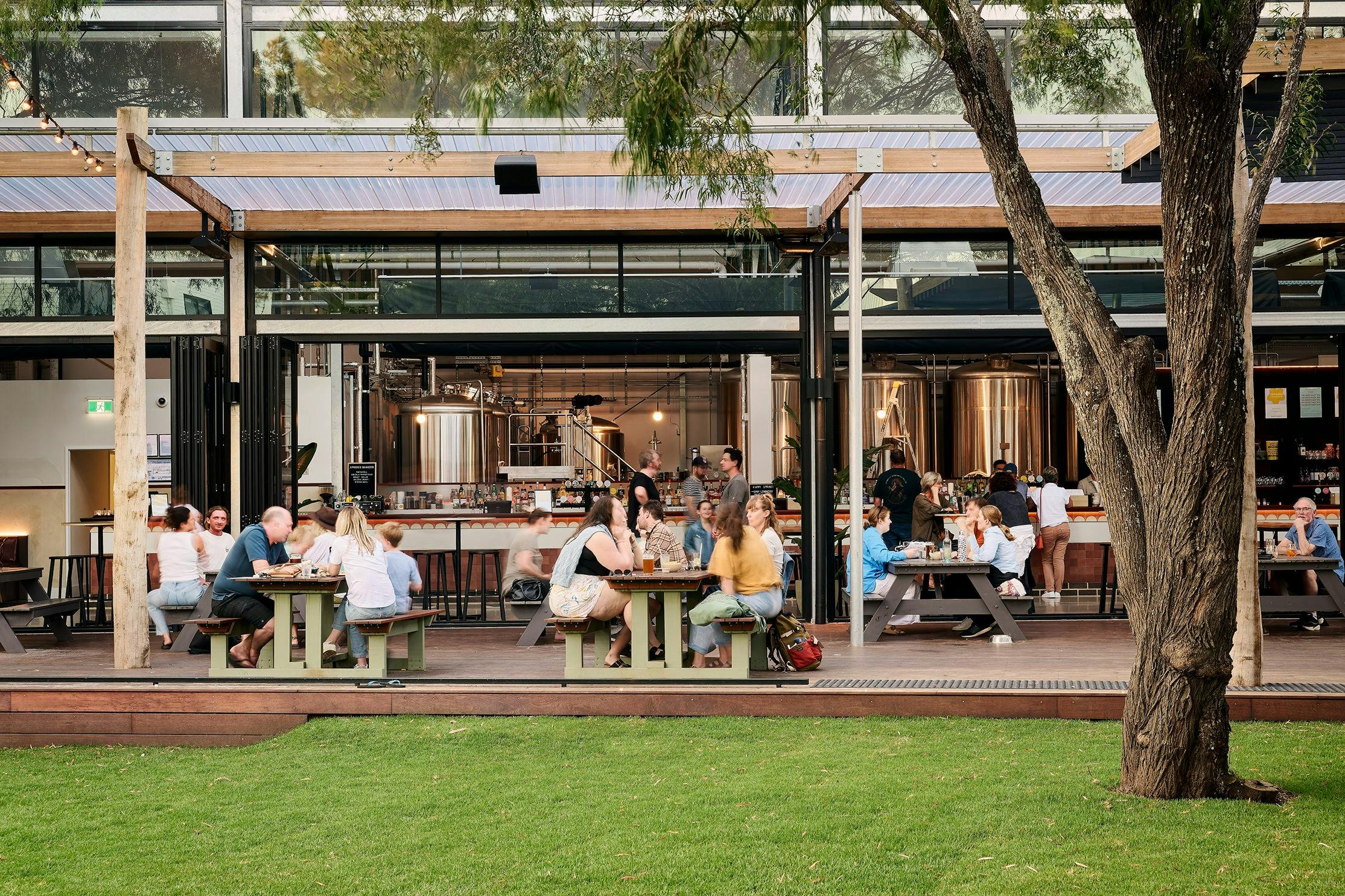 People enjoying drink and a meal on the deck