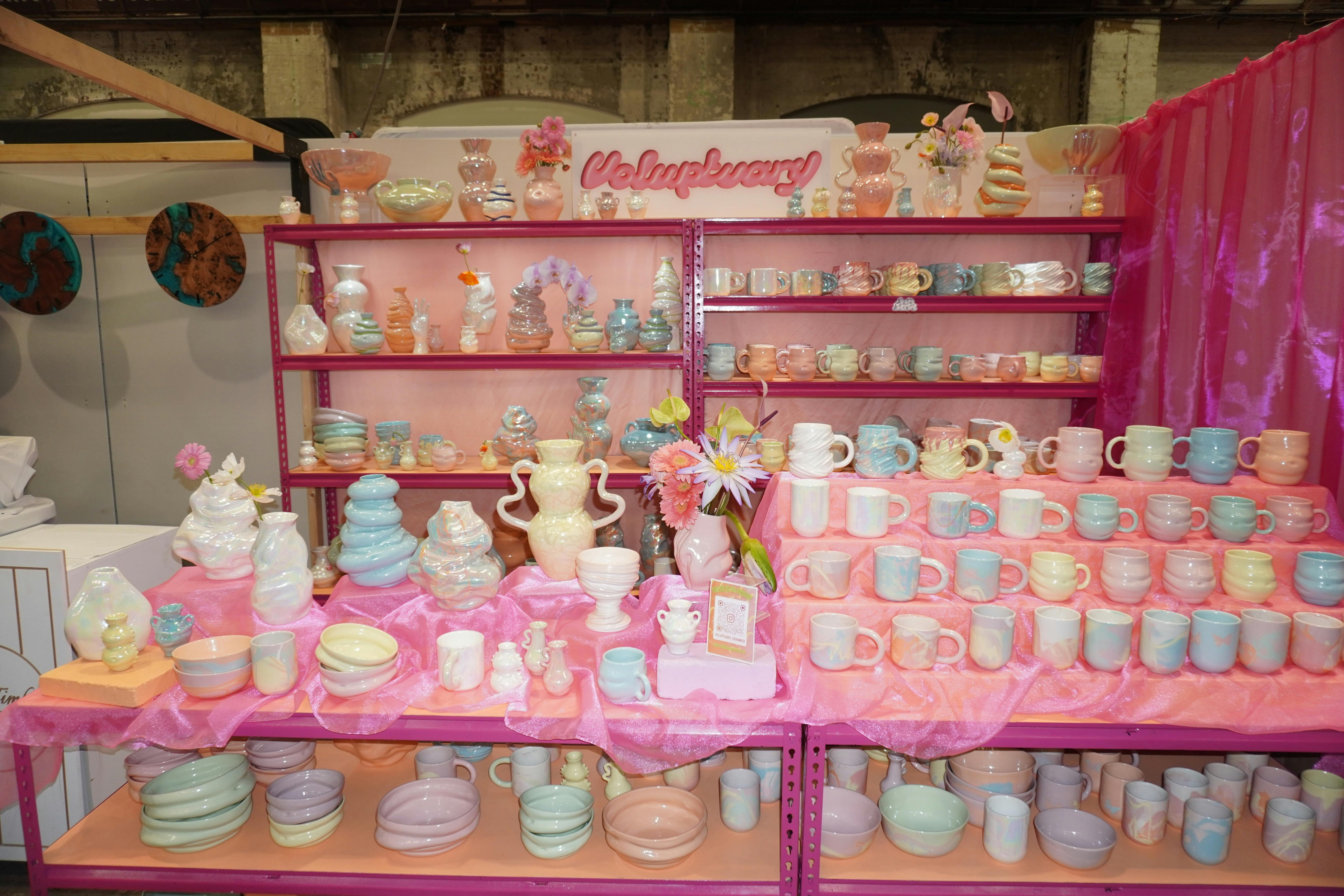A photo of a colourful ceramic stall at a marker.