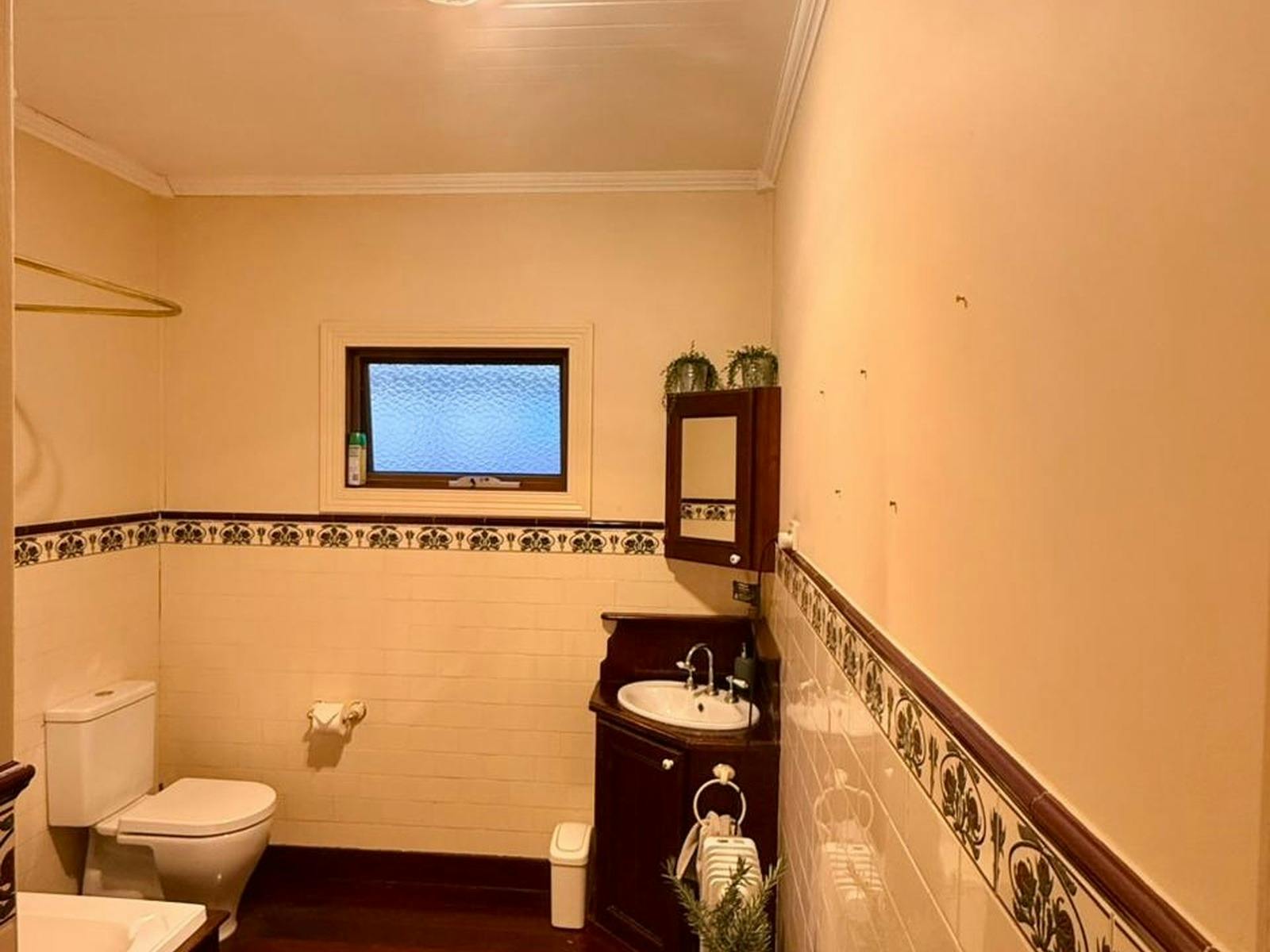 Spacious timber bathroom with a soothing tub perfect to unwind with a glass of wine afte