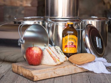 Outback Pioneers Billy-Can Lunch - Save 25%. Includes sandwich, apple, drink and biscuit Outback Pioneers Billy-Can Lunch - Save 25%. Includes sandwich, apple, drink and biscuit