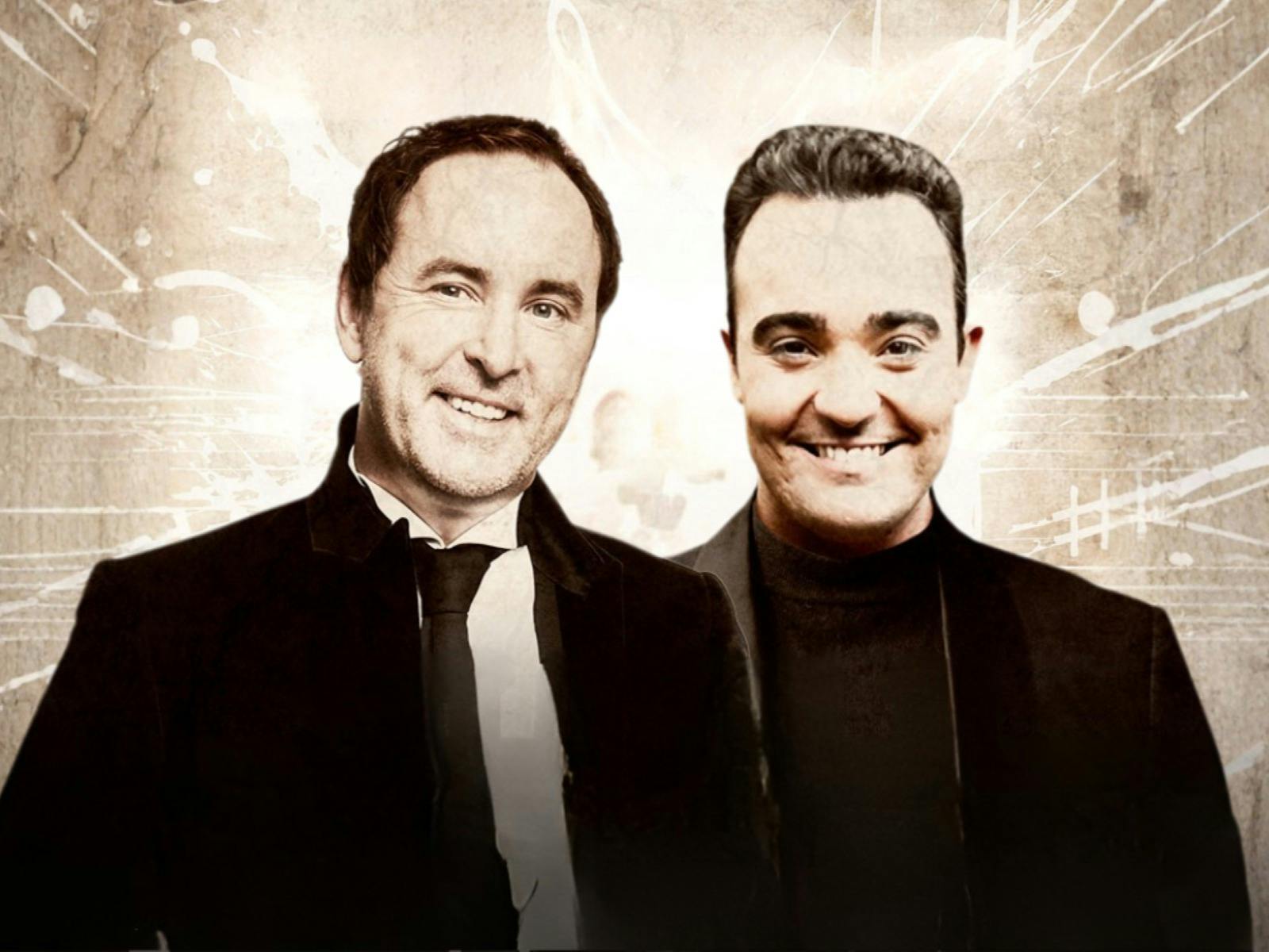 Two men looking forward and smiling