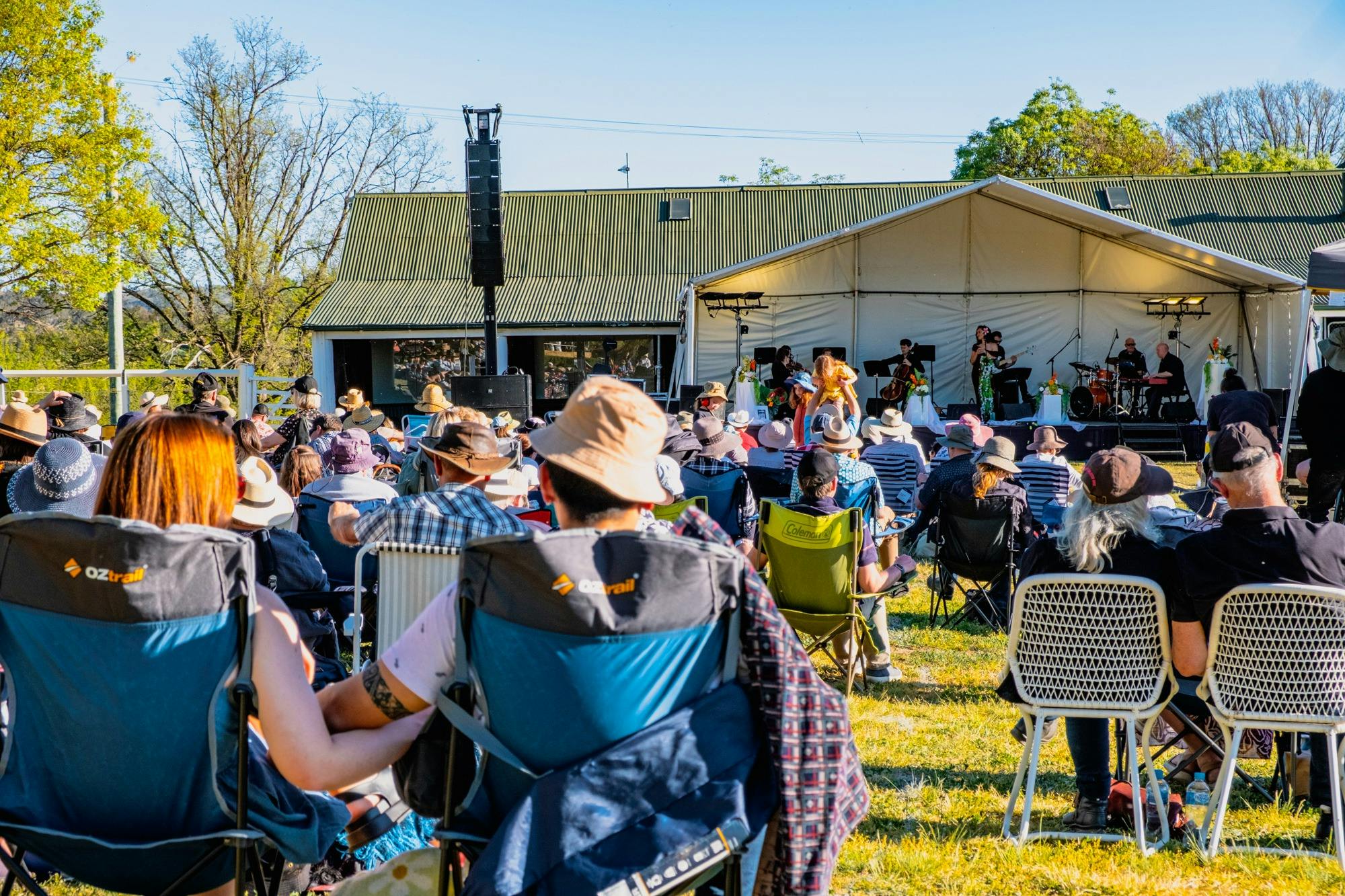 People watching CSO perform at Live at Lanyon with large picnicking crowd